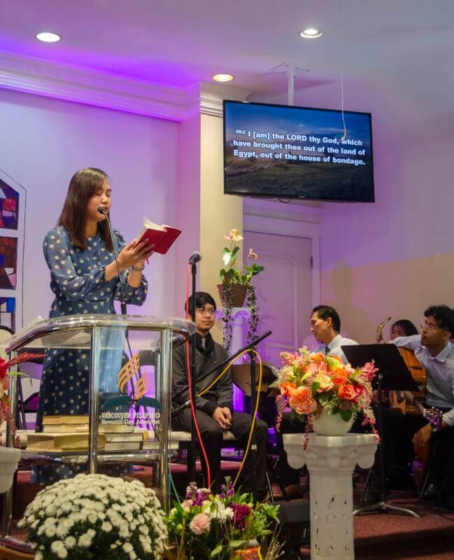 Woman giving an offertory reading