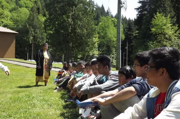 Pathfinders sitting in the sun out in a field