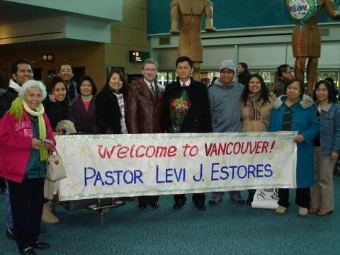 Welcome party for Pastor Levi J Estores accompanied with a welcome banner