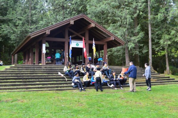 Pathfinders sitting outside practicing their ukelele performance