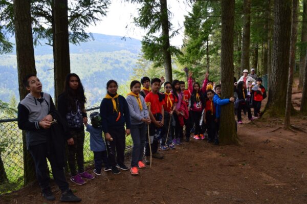 Pathfinders pose for a photo at the top of a hiking trail