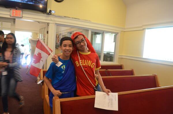 Two boys posing together fora photo in church