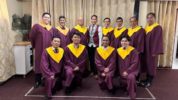 Men's choir standing all together for a photo