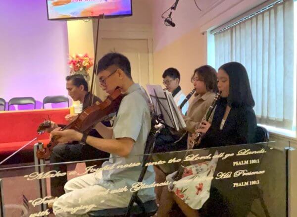 Ensemble team playing music during the church service