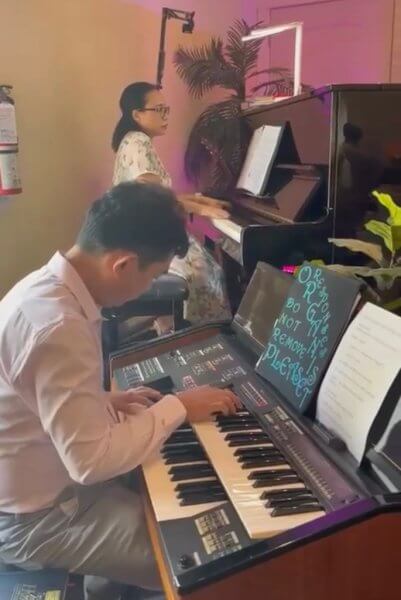 Pianist and organists playing during church service