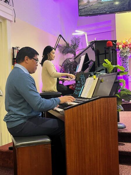 Pianist and organists playing during church service