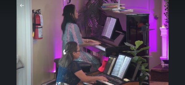 Pianist and organists playing during church service