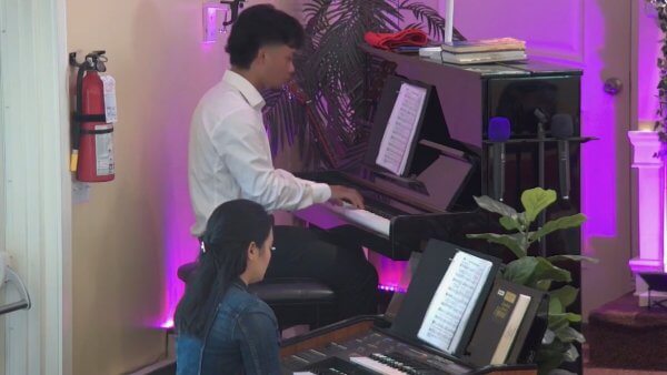 Pianist and organists playing during church service